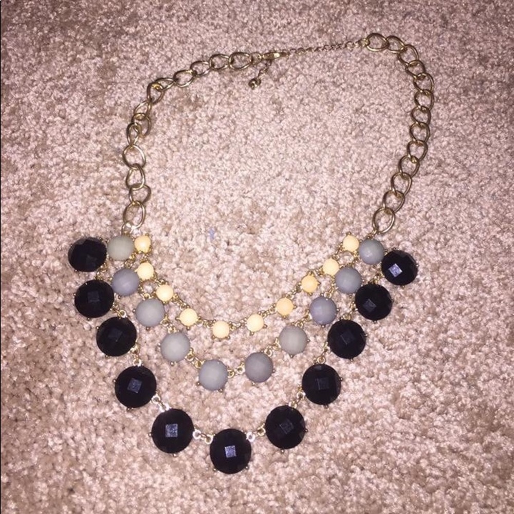 Gold necklace with cream, gray, & black stones